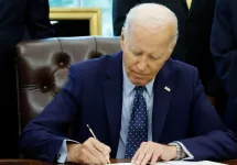 U.S. President Joe Biden signs a proclamation in the Oval Office of the White House. WASHINGTON^ DC - AUGUST 16