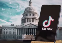 TikTok sign is sharp in the foreground^ while American Congress building is blurred in the background^ concept for TikTok ban in the United States^ USA^ March 8^ 2024