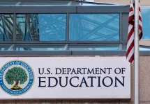 The exterior sign and US flag in front of the U.S. Department of Education offices. Washington^ DC USA; September 5^ 2024: