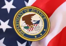 US Department of Justice seal on United States of America flag close up