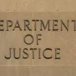 Sign "Department of Justice" on the Facade of the DoJ Building Washington^ DC^ USA - 16 July 2021