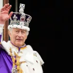 King Charles III on the balcony of Buckingham Palace following the Coronation at Westminster Abbey on May 6^ 2023 in London^ England