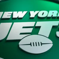 New York Jets logo on dark background with shiny details. 3D render