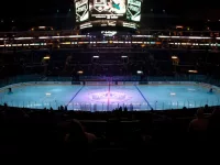 pro ice hokey rink lit up at nighttime