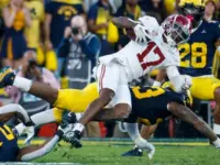Alabama wide receiver Isaiah Bond (R)is tackled during the 2024 Rose Bowl game Monday^ Jan. 1^ 2024^ in Pasadena^ Calif.