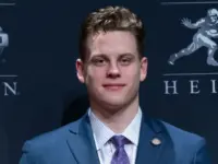 Quarterback Joe Burrow of the LSU Tigers winner of the 85th annual Heisman Memorial Trophy poses with trophy at the Marriott Marquis Hotel New York^ NY - December 14^ 2019