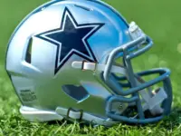 NFL Dallas Cowboys replica helmet on artificial grass playing turf ^ product shot