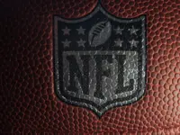 Closeup of an NFL logo on an American football