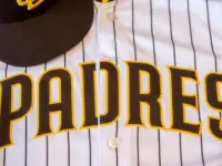 San Diego Padres baseball hat and team jersey.