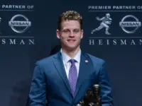 Quarterback Joe Burrow of the LSU Tigers winner of the 85th annual Heisman Memorial Trophy poses with trophy at the Marriott Marquis Hotel New York^ NY - December 14^ 2019
