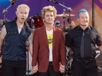 Mike Dirnt^ Billie Joe Armstrong^ Tre Cool pose on stage during ABC Good Morning America rock group Green Day concert in Central Park in New York on July 26^ 2024