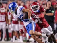 NCAA Football^ BYU 38:31 Ark- Cougars WR Parker Kingston (82) catches a pass fights off Razorbacks DB Lorando Johnson (1) the game at Razorback Stadium^ Fayetteville^ AR. Sept 16^ 2023