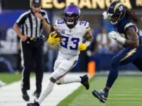 Minnesota Vikings running back Aaron Jones in runs against the Los Angeles Chargers during an NFL football game Oct. 23^ 2025^ in Inglewood^ Calif.