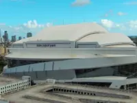 Aerial shot of LoanDepot Park with skyscrapers and office buildings in the city skyline^ lush green palm trees and cars on the street in Miami Florida USA Miami Florida USA - 11 -12-2024