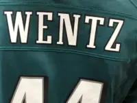 A fan wears the jersey of injured Eagles quarterback Carson Wentz in a mall. Minneapolis^ MN/USA- February 1^ 2018