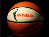 Generate a basketball with the WNBA logo^ the background must be completely black but the ball must be illuminated artistically.