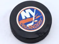 New York Islanders logo on Ice hockey puck outdoors in snow OREBRO^ SWEDEN - FEBRUARY 3^ 2019