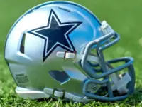 NFL Dallas Cowboys helmet on artificial grass playing turf ^ product shot