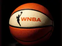 AI Generated photo featuring basketball with the WNBA logo^ background is completely black with ball illuminated artistically. (This content was generated by an Artificial Intelligence (AI) system.)
