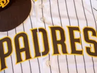 San Diego Padres baseball hat and team jersey.