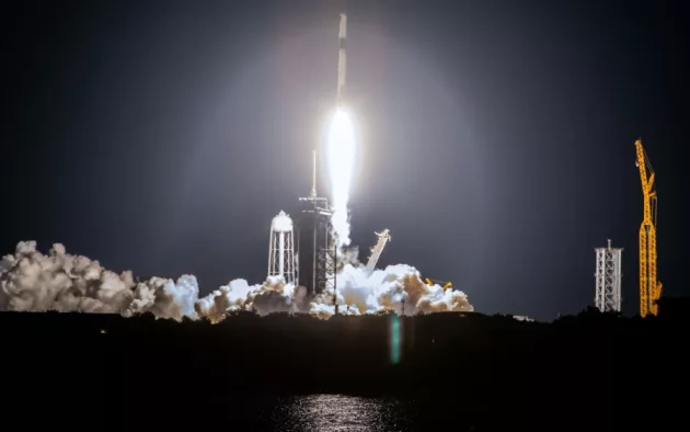 SpaceX rocket Falcon 9 rocket capsule soars upward after lifting off from launch pad. Digitally enhanced. Elements of this image furnished by NASA.