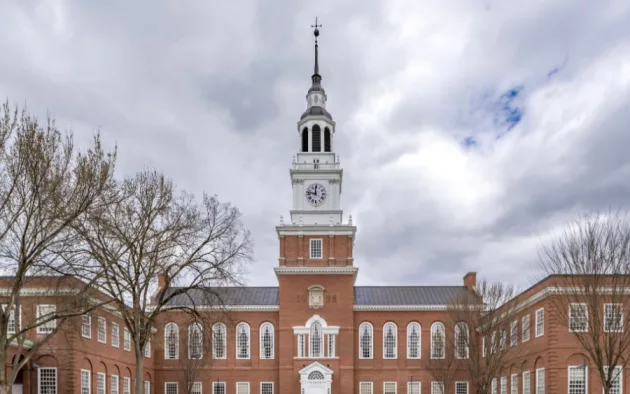 Photo of Baker-Berry Library^ Dartmouth College located in Hanover^ New Hampshire^ USA on a mostly cloudy spring day. Hanover^ NH^ USA - 04-21-2024