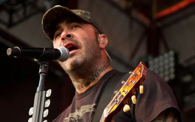 Aaron Lewis plays his guitar druing the performance of Staind Rockstar Uproar Festival on September 25^ 2012 in Nampa^ Idaho.