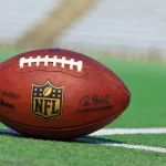 NFL football on grass turf background