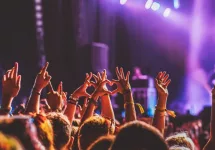 crowd partying stage lights live concert summer music festival