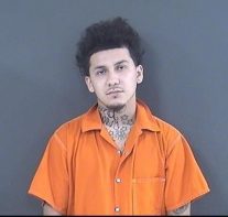 mugshot of man in orange jumpsuit