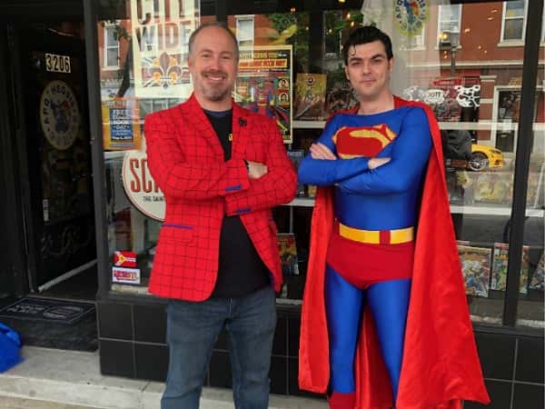 comic collector with man dressed as superman