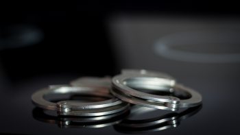 handcuffs on a glass table