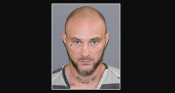 mugshot of matty b with name tattooed on his neck