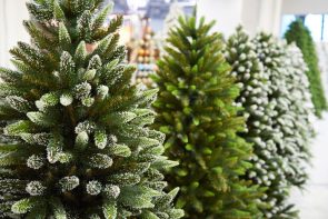 line of artificial christmas trees